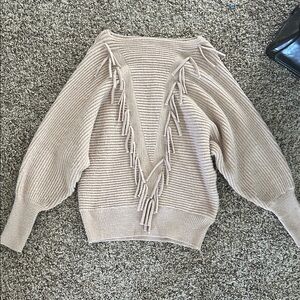 Pale pink sweater with fringe